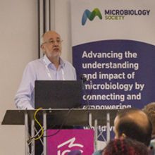 Speaker delivering a talk during Microbiology Society's Annual Conference