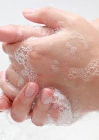 Hands with soap being washed
