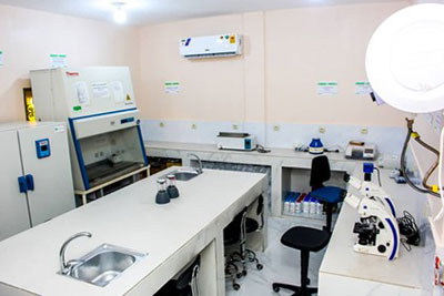 Laboratory with microscopes, sink and other machinery