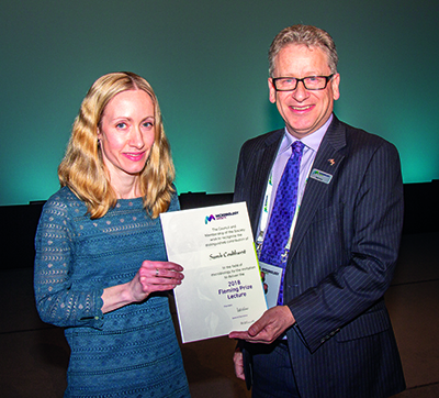 Neil Gow, President of the Society 2016–2018, presenting Sarah Coulthurst with the 2018 Fleming Prize.
