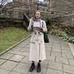 Lizzy Cairns holding a certificate