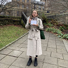 Lizzy Cairns holding a certificate