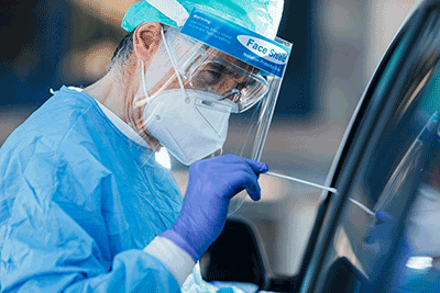 Person holding a Covid swab test