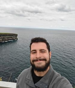 Headshot of Liam Cremona by the sea