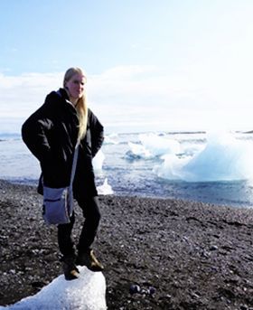 Laura Glendinning standing on a beach.