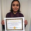 Farhanna holding a Coccus Pocus certificate