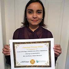 Farhanna holding a Coccus Pocus certificate
