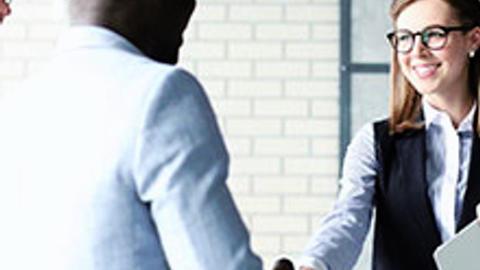 Two people shaking hands.