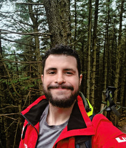 Liam Cremona headshot in the forest