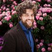 Edze Westra with pink flowers in the background
