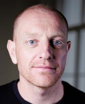 Headshot of Stephen Baker.