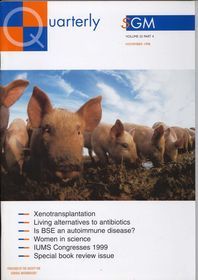 Microbiology Today front cover with multiple pigs in a field.