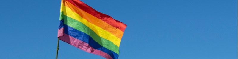 rainbow-flag-with-blue-sky-lgbtq-picture-id1151021767.jpg